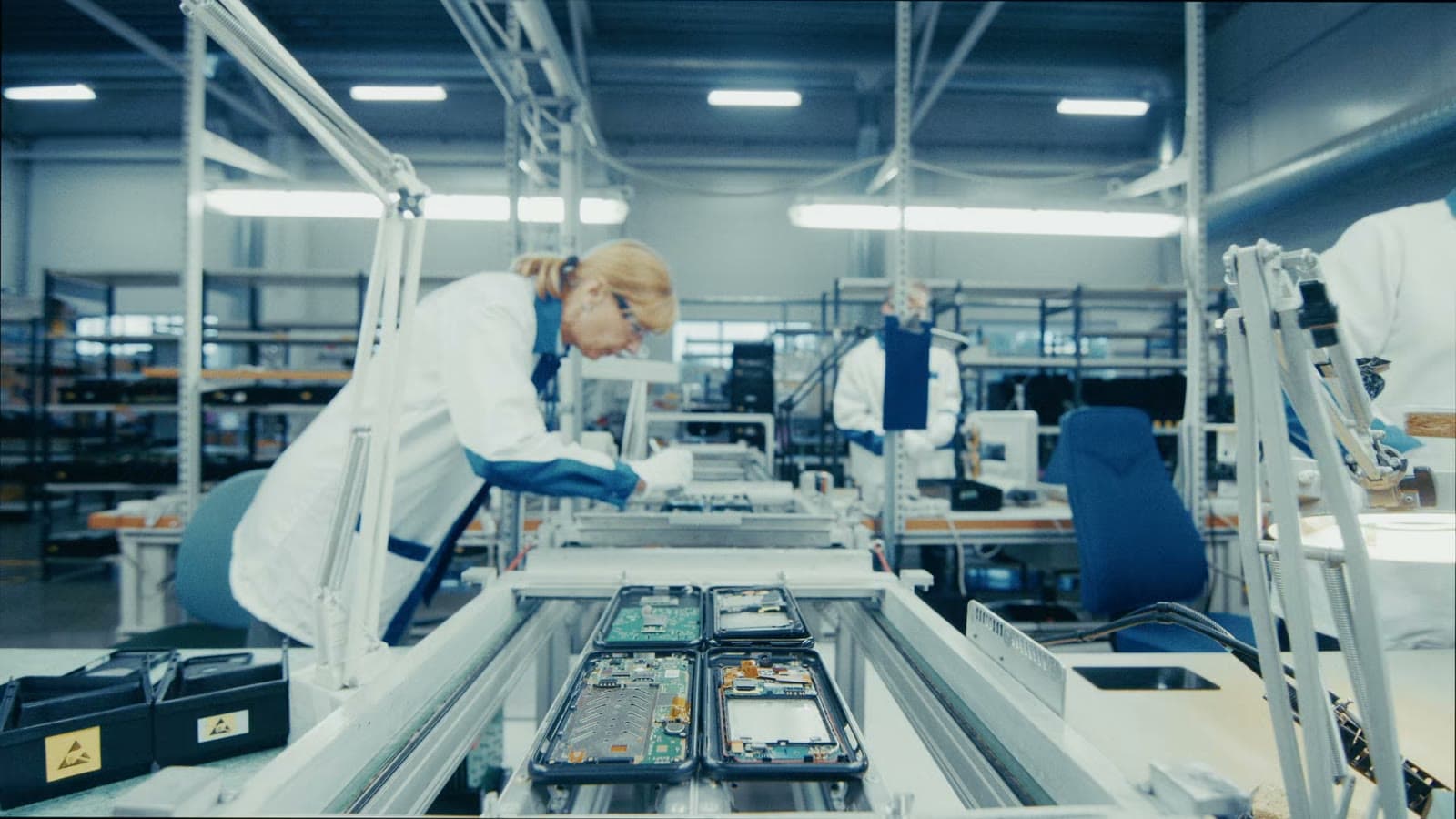 An operator at an electronics assembly line
